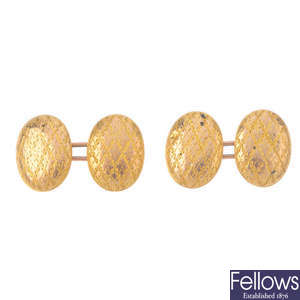 An intaglio signet ring and a pair of early 20th century gold cufflinks.