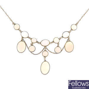 An early 20th century gold and opal cabochon necklace.