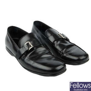 PRADA- a pair of men's black leather loafers.