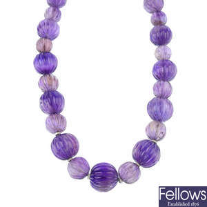 An amethyst bead necklace. 