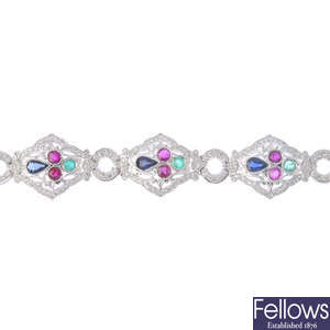 A diamond and multi-gem bracelet.