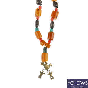 A natural amber, turquoise, quartz and glass bead necklace. 