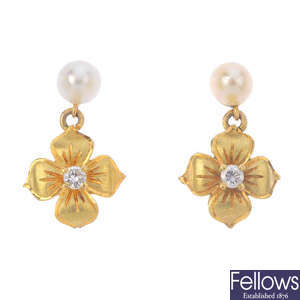 A pair of cultured pearl and diamond floral earrings.