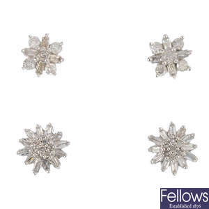 Two pairs of diamond earrings.