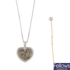 A diamond pendant and stickpin.