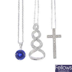 A selection of three diamond and gem-set pendants.