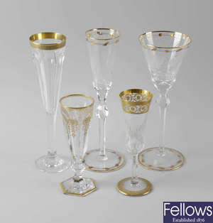 Five pairs of gilt-enriched champagne and wine glasses