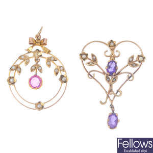Two gem-set pendants.