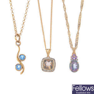 Three 9ct gold diamond and gem-set pendants, with chains.
