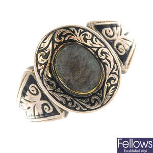 A late Victorian memorial woven hair and black enamel ring. 
