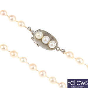 Four strands of cultured and imitation pearl necklaces. 