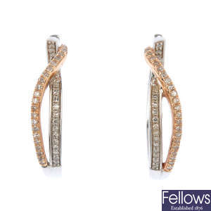 A pair of 14ct gold diamond hoop earrings.