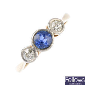 An early 20th century gold sapphire and diamond three-stone ring.