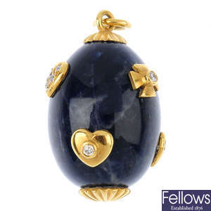 A lapis lazuli and cubic zirconia pendant.