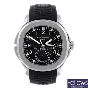 PATEK PHILIPPE - a gentleman's stainless steel Aquanaut Travel Time wrist watch.
