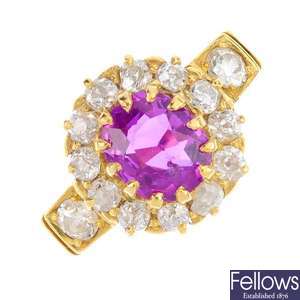 A late Victorian 18ct gold ruby and diamond cluster ring.