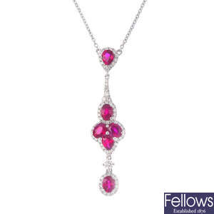 An 18ct gold ruby and diamond pendant, on chain.