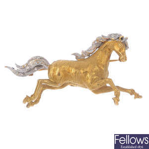 An 18ct gold diamond horse brooch.