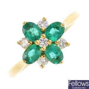An 18ct gold emerald and diamond floral cluster ring.
