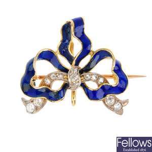 An early 20th century gold, diamond and enamel bow brooch.
