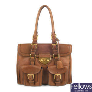 PRADA - a brown Antic Lock handbag.