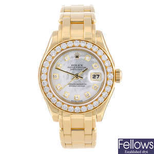 CURRENT MODEL: ROLEX - a lady's 18ct yellow gold Oyster Perpetual Datejust Pearlmaster bracelet watch.