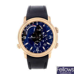 CURRENT MODEL: BLANCPAIN - a gentleman's 18ct rose gold Leman Réveil GMT wrist watch.