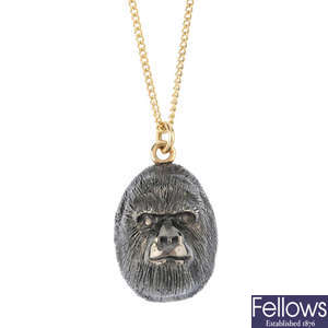 A 9ct gold gorilla pendant, with chain.