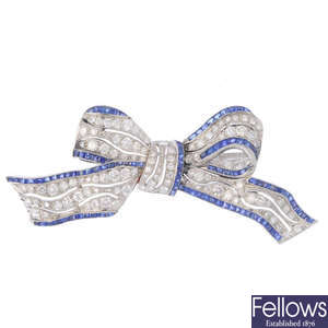 A mid 20th century diamond and sapphire bow brooch.