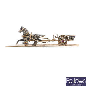 An early 20th century 15ct gold diamond horse and carriage brooch.
