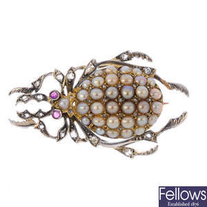 A split pearl and diamond scarab beetle brooch.