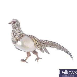 A blister pearl and diamond pheasant brooch.