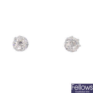 A pair of old-cut diamond stud earrings.