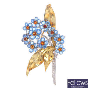 A mid 20th century diamond and gem-set floral brooch.