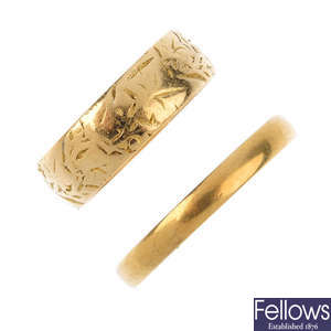 A late Victorian 18ct gold band ring and an early 20th century 18ct gold band ring.
