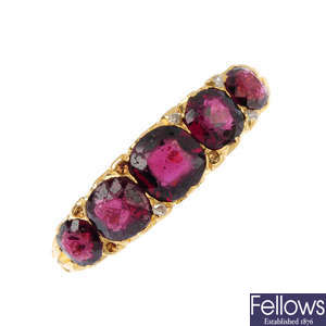 An 18ct gold garnet and diamond five-stone ring.