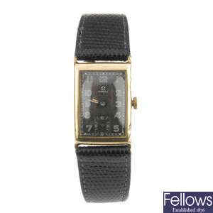 OMEGA - a gentleman's yellow metal wrist watch together with a gold plated Waltham wrist watch.