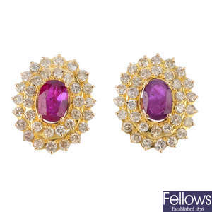 A pair of glass-filled ruby and diamond cluster earrings.