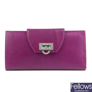 SALVATORE FERRAGAMO - a purple Gancini purse.