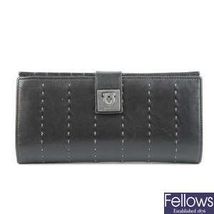 SALVATORE FERRAGAMO - a black leather purse.