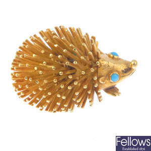 A 1970s 18ct gold turquoise hedgehog brooch.