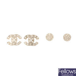 Four pairs of diamond and cubic zirconia earrings.