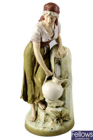 A large Royal Dux porcelain figure of a female water-carrier