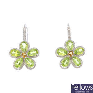 A pair of citrine, peridot and diamond earrings.