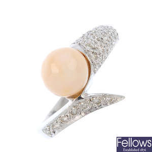 A natural pearl and diamond crossover ring.