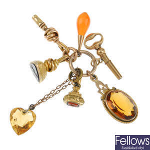 A key ring suspending a selection of fobs, watch keys and charms.