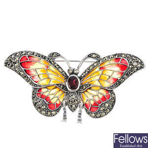 A garnet, marcasite and plique-a-jour enamel butterfly brooch.