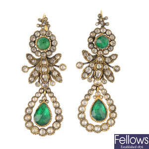 A pair of foil-back emerald and diamond earrings.