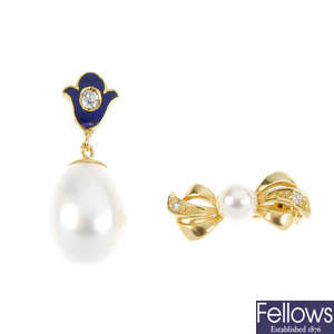 A cultured pearl and diamond spacer and pendant.