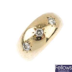 A gentleman's 9ct gold diamond three-stone ring.